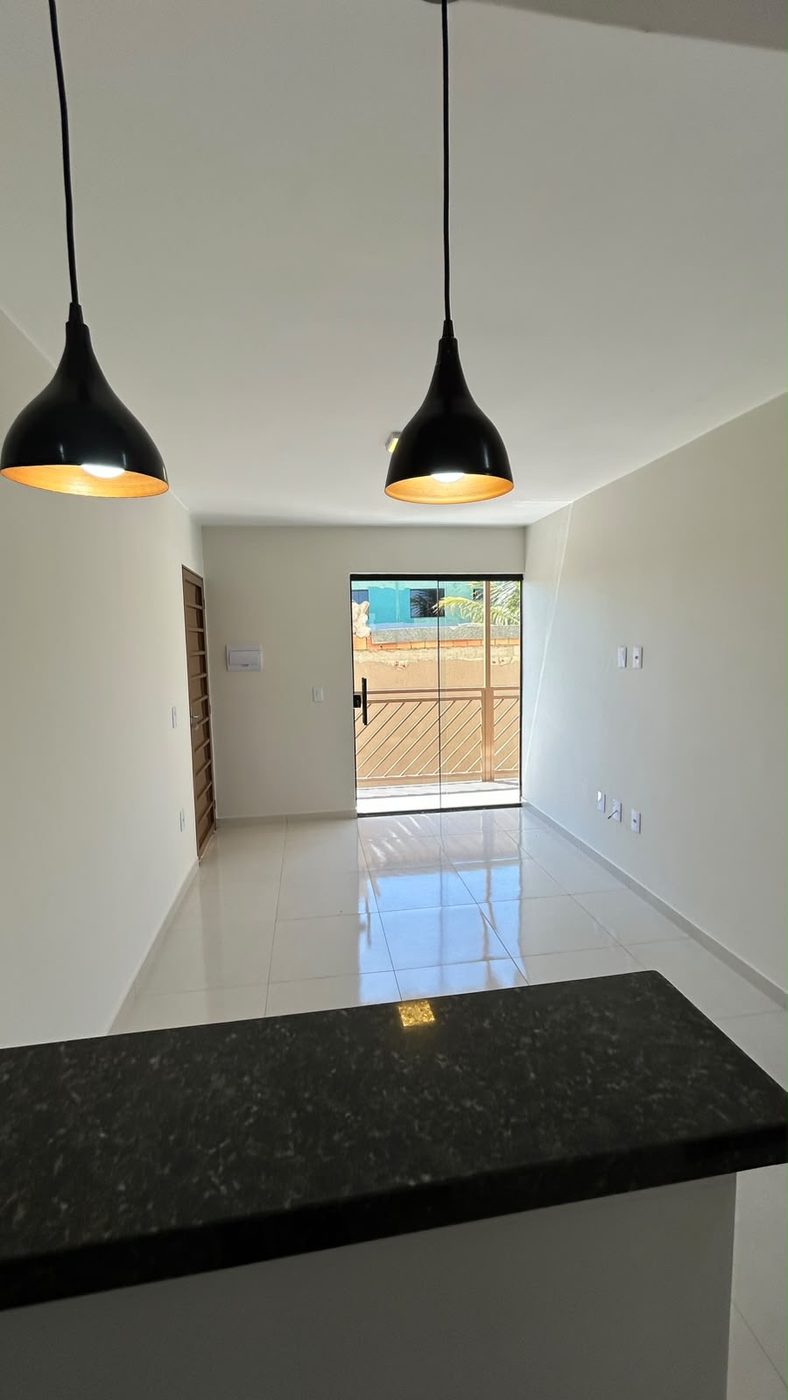 Sala iluminada com saída para a varanda — JVA Construtora e Incorporadora